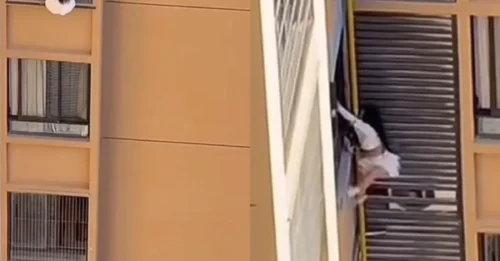 Momento aterrador en el que una amante casi se precipita hasta la muerte desde una ventana del décimo piso mientras escapa de la esposa de su amante